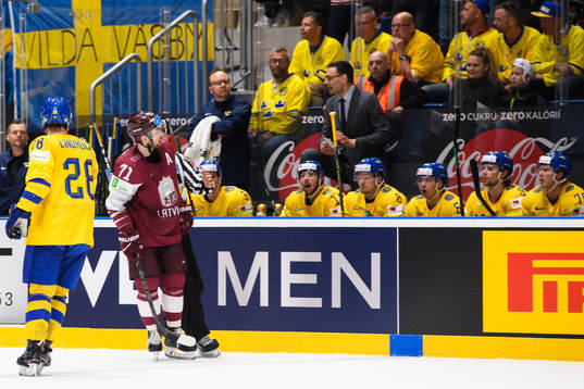 Roberts Bukarts of Latvia celebrates in front of the