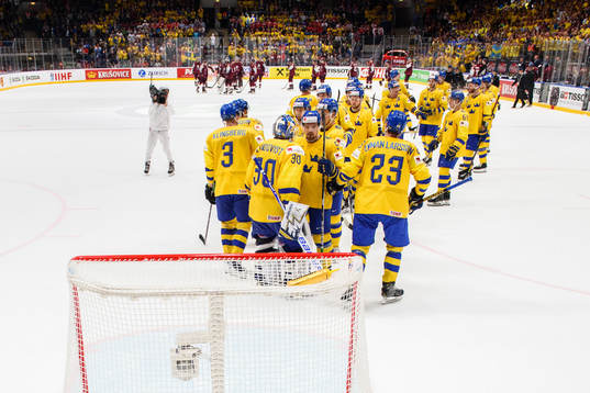 The players of Sweden celebrates with goaltender Henrik