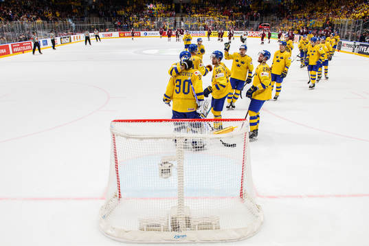 The players of Sweden celebrates with goaltender Henrik