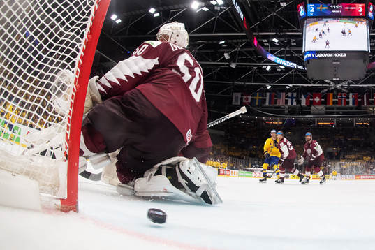 Anton Lander of Sweden scores 3-3 behind goaltender