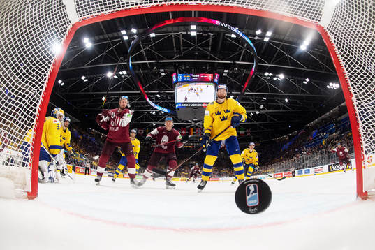 Goaltender Henrik Lundqvist of Sweden lets in the 1-1 goal