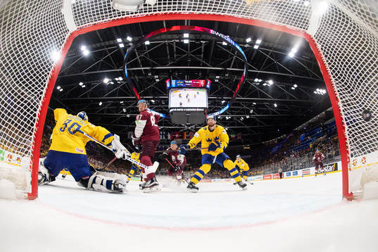 Goaltender Henrik Lundqvist of Sweden lets in the 1-1 goal