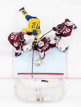 Patric Hörnqvist of Sweden scores 4-3 behind Uvis