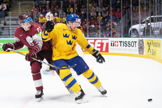 Oskars Cibulskis of Latvia and Gabriel Landeskog of Sweden