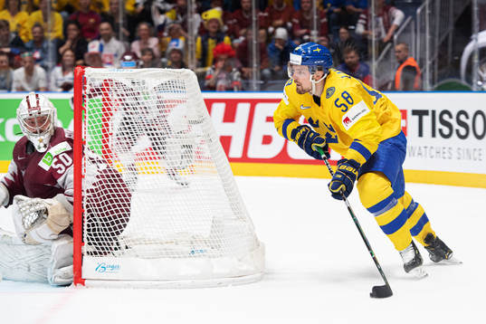 Goaltender Kristers Gudlevskis of Latvia and Anton Lander