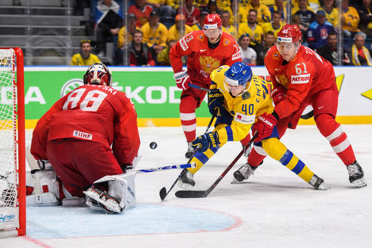 Elias Pettersson of Sweden against goaltender Andrei