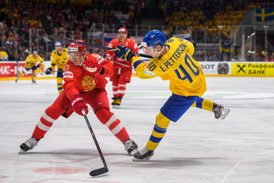 Nikita Zadorov of Russia and Elias Pettersson of Sweden