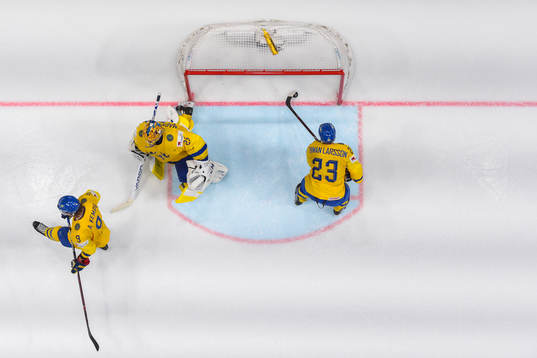 Adrian Kempe, goaltender Jacob Markström and Oliver Ekman