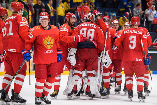 The players of Russia celebrate with Mikhail Sergachyov
