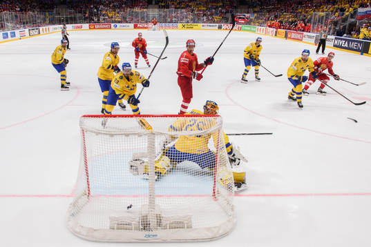 Dmitry Orlov of Russia scores the 2-7 goal behind