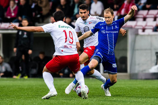 Kjell Rune Sellin and Maikel of FFK against Matti Lund