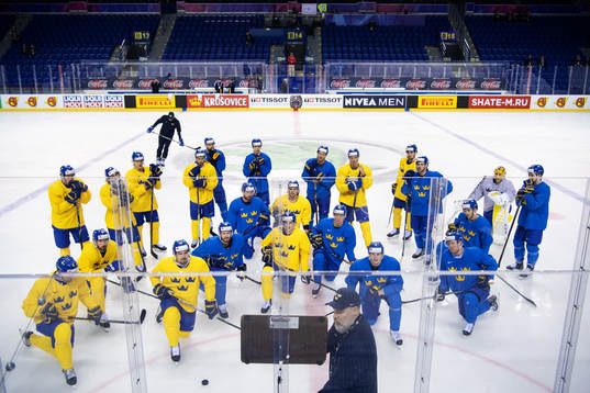 Players listen to head coach Rikard Grönborg of team
