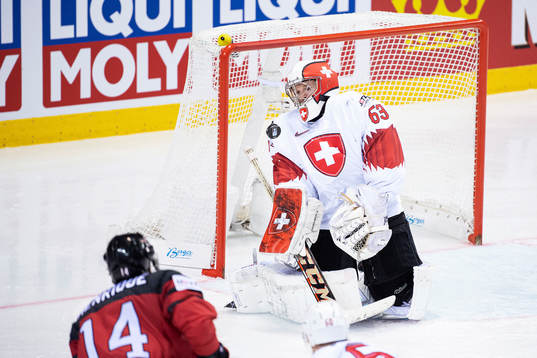 Adam Henrique of Canada shoots against goaltender Leonardo