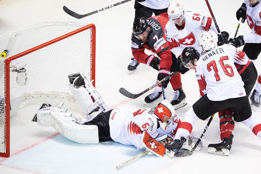 Sean Couturier and Anthony Cirelli of Canada in action