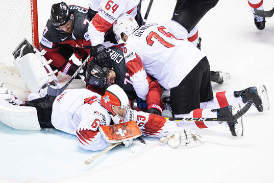 Sean Couturier and Anthony Cirelli of Canada in action