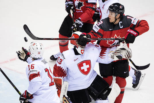 Kyle Turris of Canada against goaltender Leonardo Genoni of