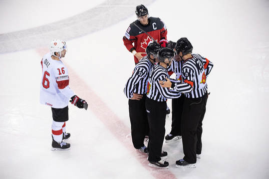Raphael Diaz of Switzerland and Kyle Turris of Canada as