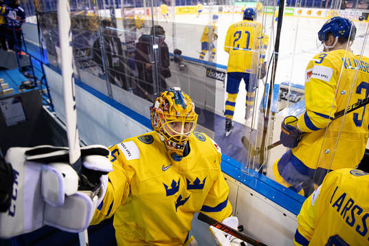 Goaltender Jacob Markström of Sweden fist bumps with a fan
