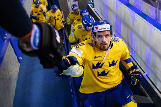 Anton Lander of Sweden fist bumps with a fan