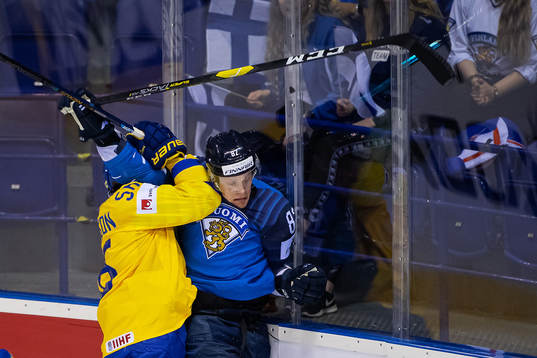 Erik Gustafsson of Sweden with a tackle against Harri
