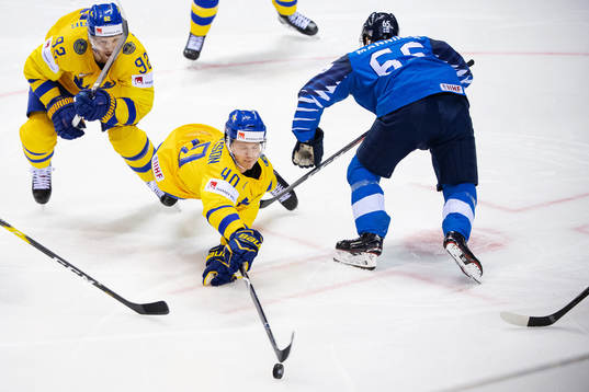 Gabriel Landeskog and Elias Pettersson of Sweden  against