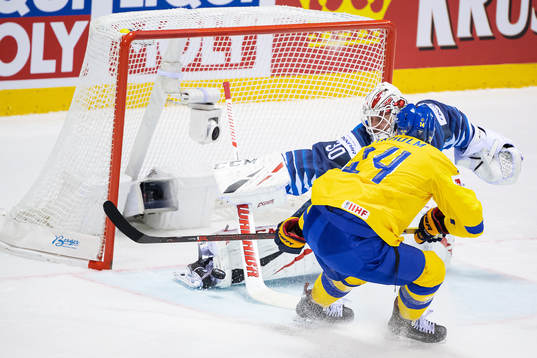 goaltender Kevin Lankinen of Finland with a save against