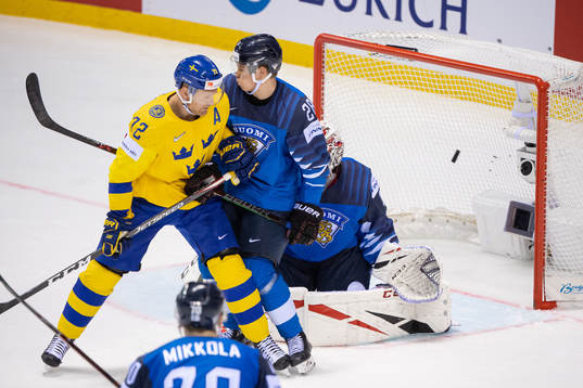 Erik Gustafsson of Sweden (not in picture) scores 3-4