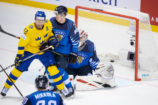 Erik Gustafsson of Sweden (not in picture) scores 3-4