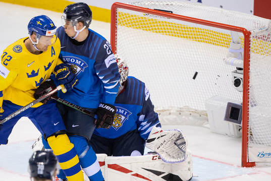A camera in the goal gets hit by a puck when Erik