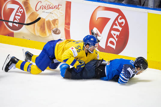 Juho Lammikko of Finland  is held down by Erik Gustafsson