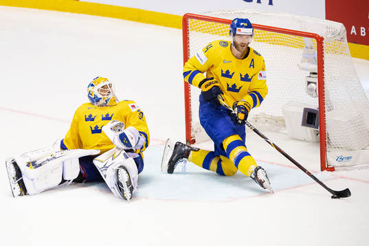 goaltender Henrik Lundqvist and Mattias Ekholm of Sweden