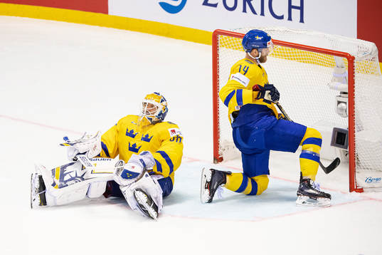 goaltender Henrik Lundqvist and Mattias Ekholm of Sweden