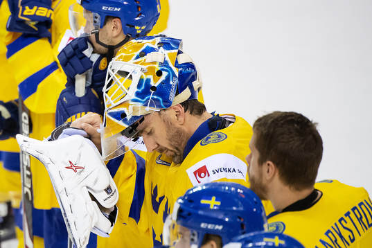 goaltender Henrik Lundqvist of Sweden looks dejected