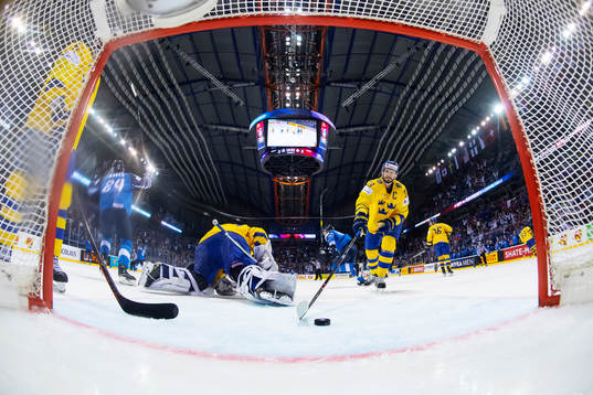 Goaltender Henrik Lundqvist and Oliver Ekman Larsson look