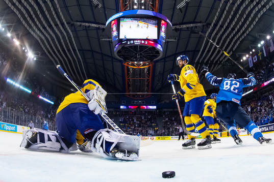 Goaltender Henrik Lundqvist and Oliver Ekman Larsson look