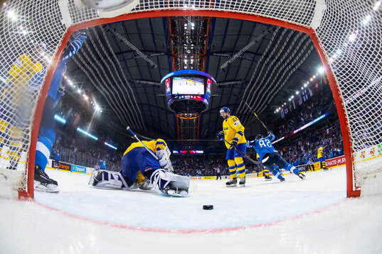 Goaltender Henrik Lundqvist and Oliver Ekman Larsson look