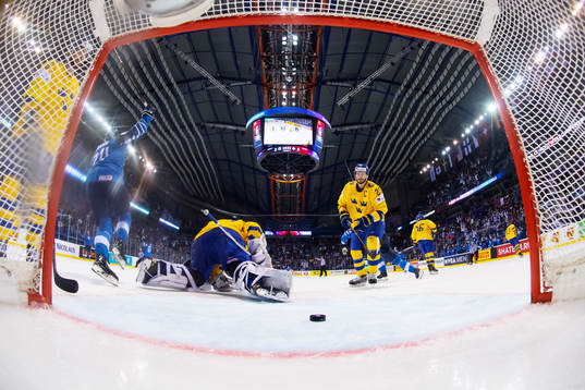 Goaltender Henrik Lundqvist and Oliver Ekman Larsson look