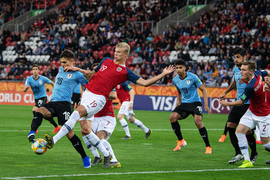 Nicolas Acevedo of Uruguay and Erling Braut Haaland of