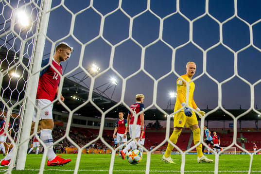 Ulrik Fredriksen and goalkeeper Julian Faye Lund of Norway