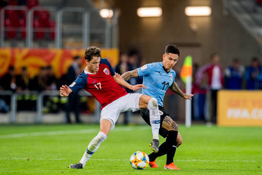 Håkon Evjen of Norway and Brian Rodriguez of Uruguay
