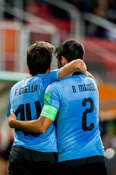 Francisco Ginella of Uruguay celebrates with teammate Bruno