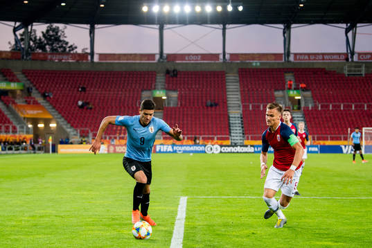 Darwin Nunez of Uruguay and Leo Skiri Østigård of Norway