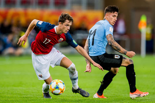 Håkon Evjen of Norway and Brian Rodriguez of Uruguay
