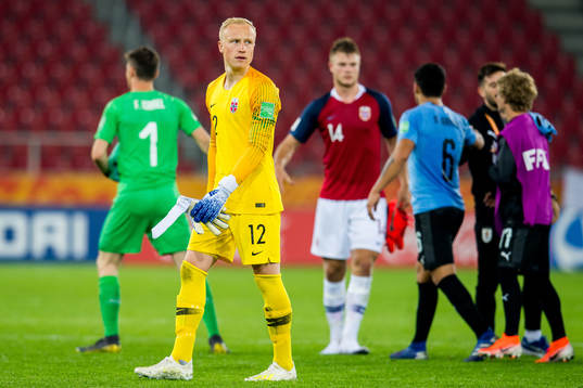 Goalkeeper Julian Faye Lund of Norway looks dejected