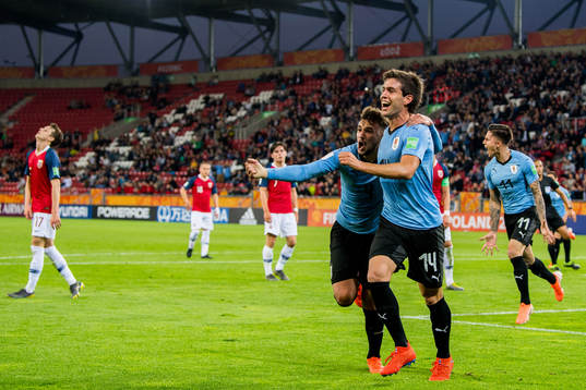 Francisco Ginella of Uruguay celebrates with teammate