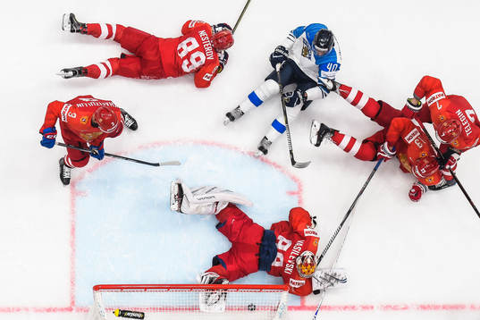 Petteri Lindbohm of Finland against goaltender Andrei