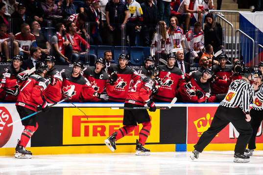Sean Couturier and Darnell Nurse celebrate with teammates