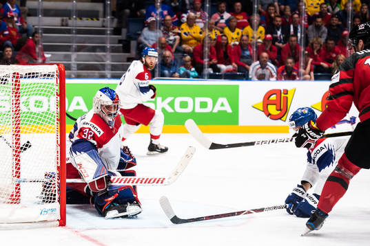 Pierre-Luc Dubois of Canada score 3-0 behind goaltender