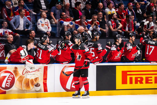 Kyle Turris of Canada celebrate with teammates