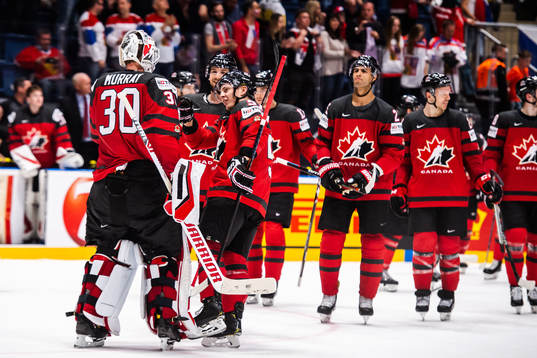 Mathieu Joseph of Canada celebrate with teammates